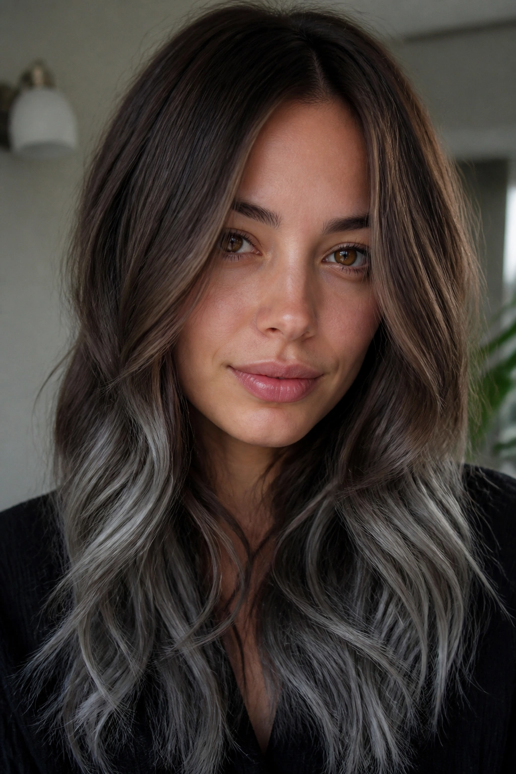 Close-up of chestnut brunette hair with gunmetal silver tint at the ends