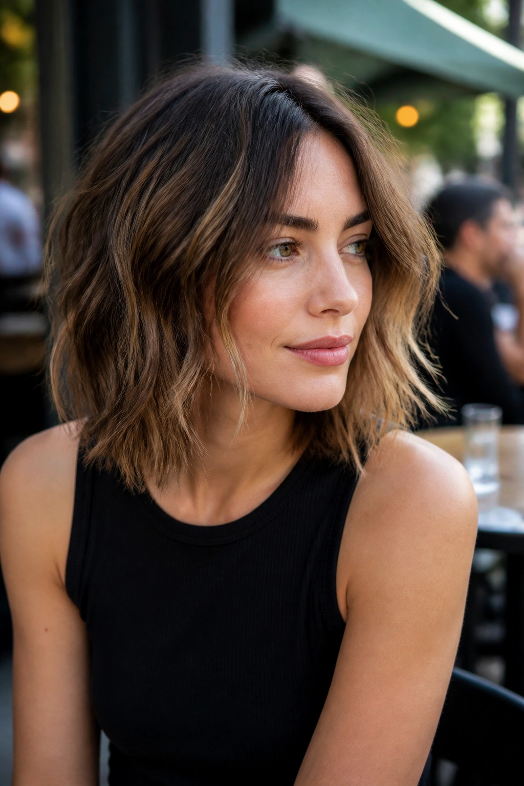 Shoulder-length choppy lob on a real woman with textured ends