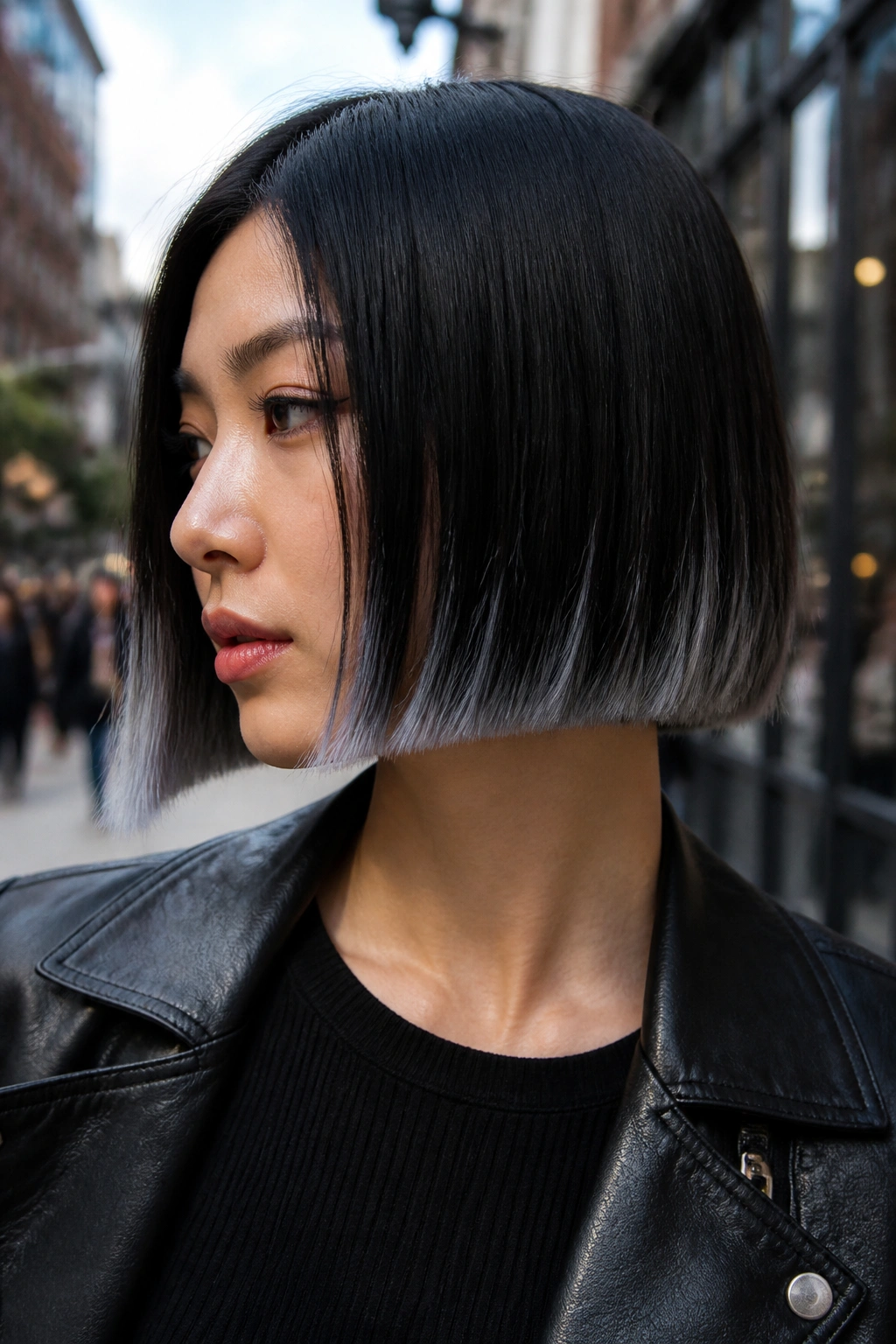 Real person with chrome-edged bob on a busy street under daylight