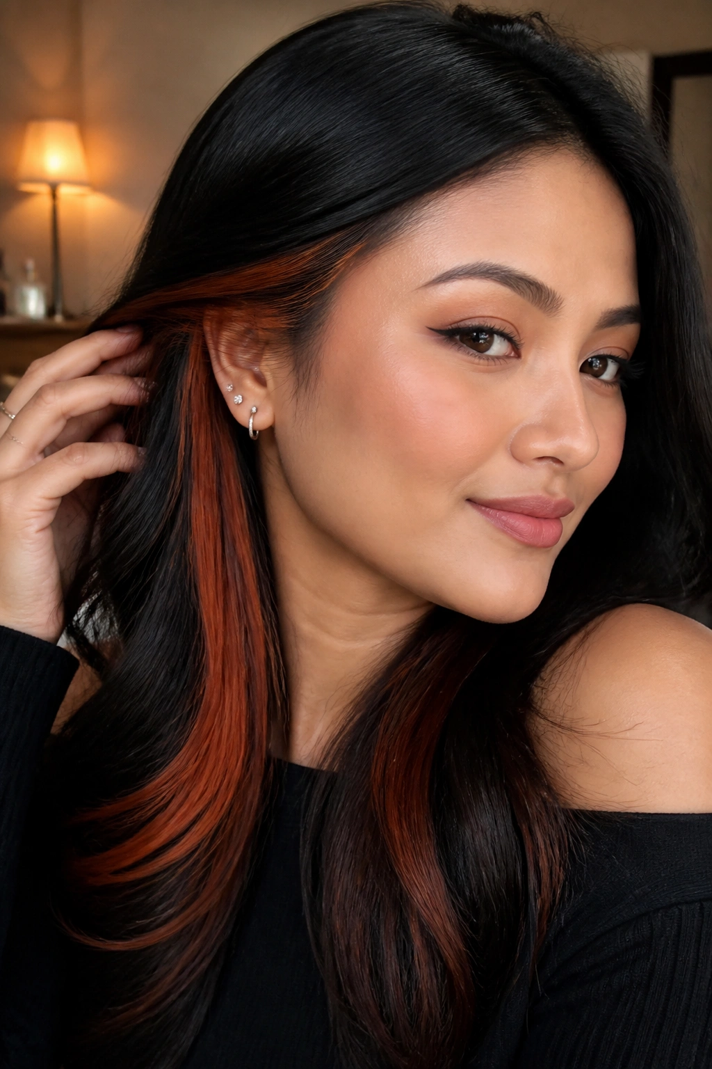 Close-up of black hair with cinnamon-copper underlights