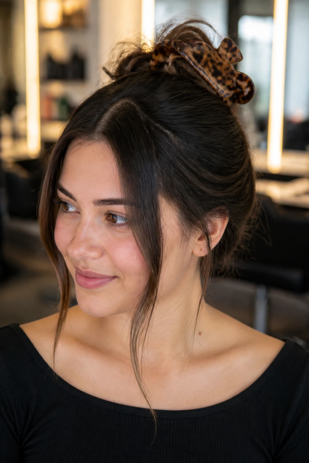 Close-up of a real person with a claw clip updo at the crown