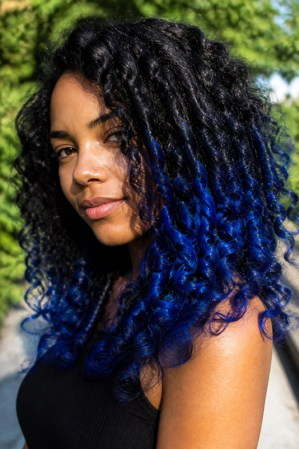 Close-up of thick curly hair with cobalt blue on outer curls.