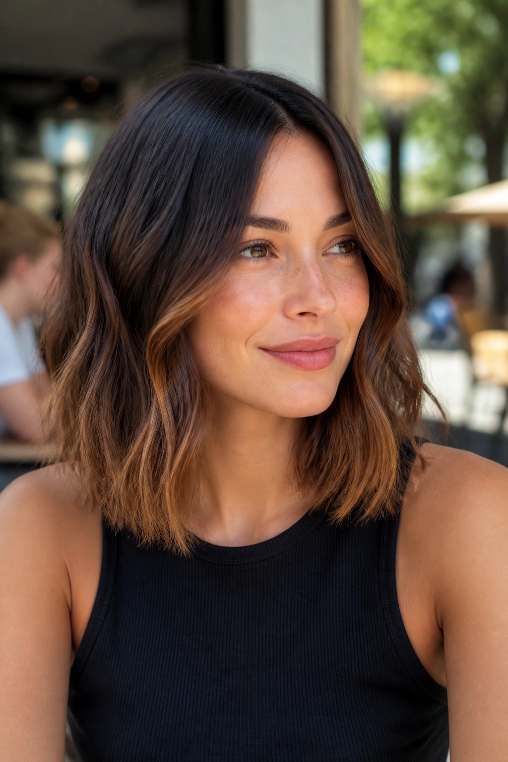 Woman with cocoa ombré shoulder-length hair