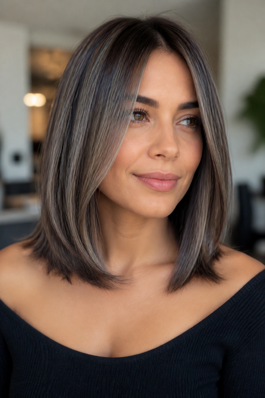 Close-up of a real woman with collarbone-length lob and vertical ribbons in hair