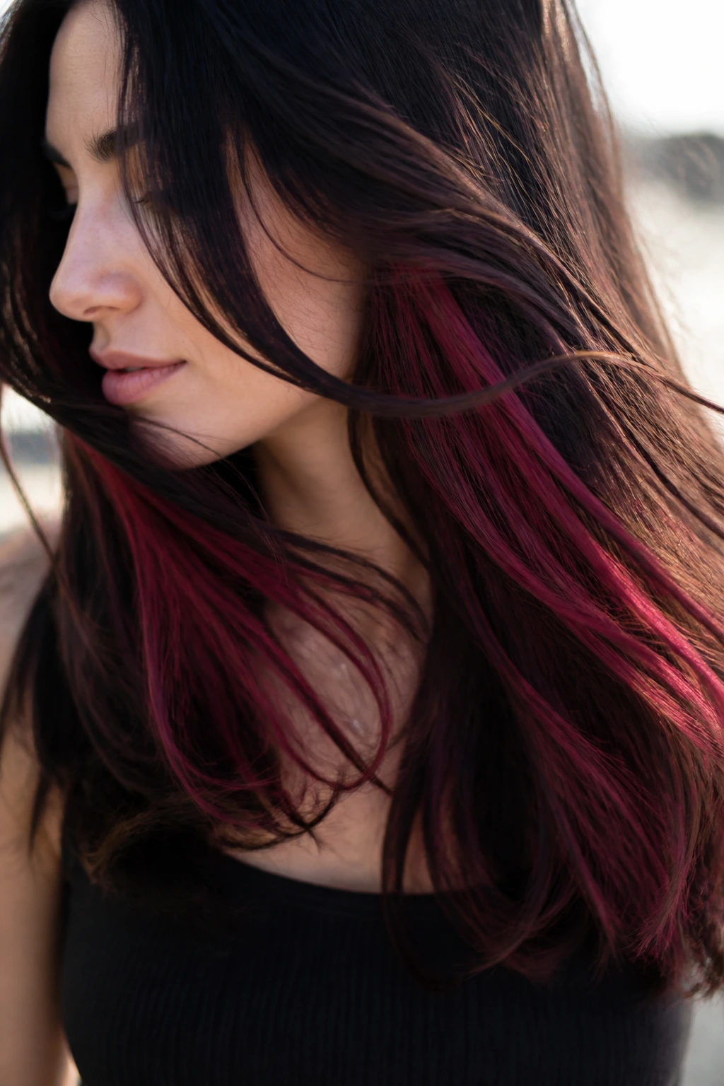 Real woman with cranberry peekaboo panels under top layer.