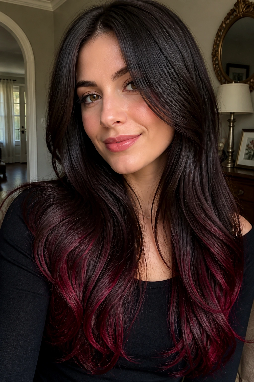 Dark brunette base with cranberry-tinted ends on a real woman's long hair.