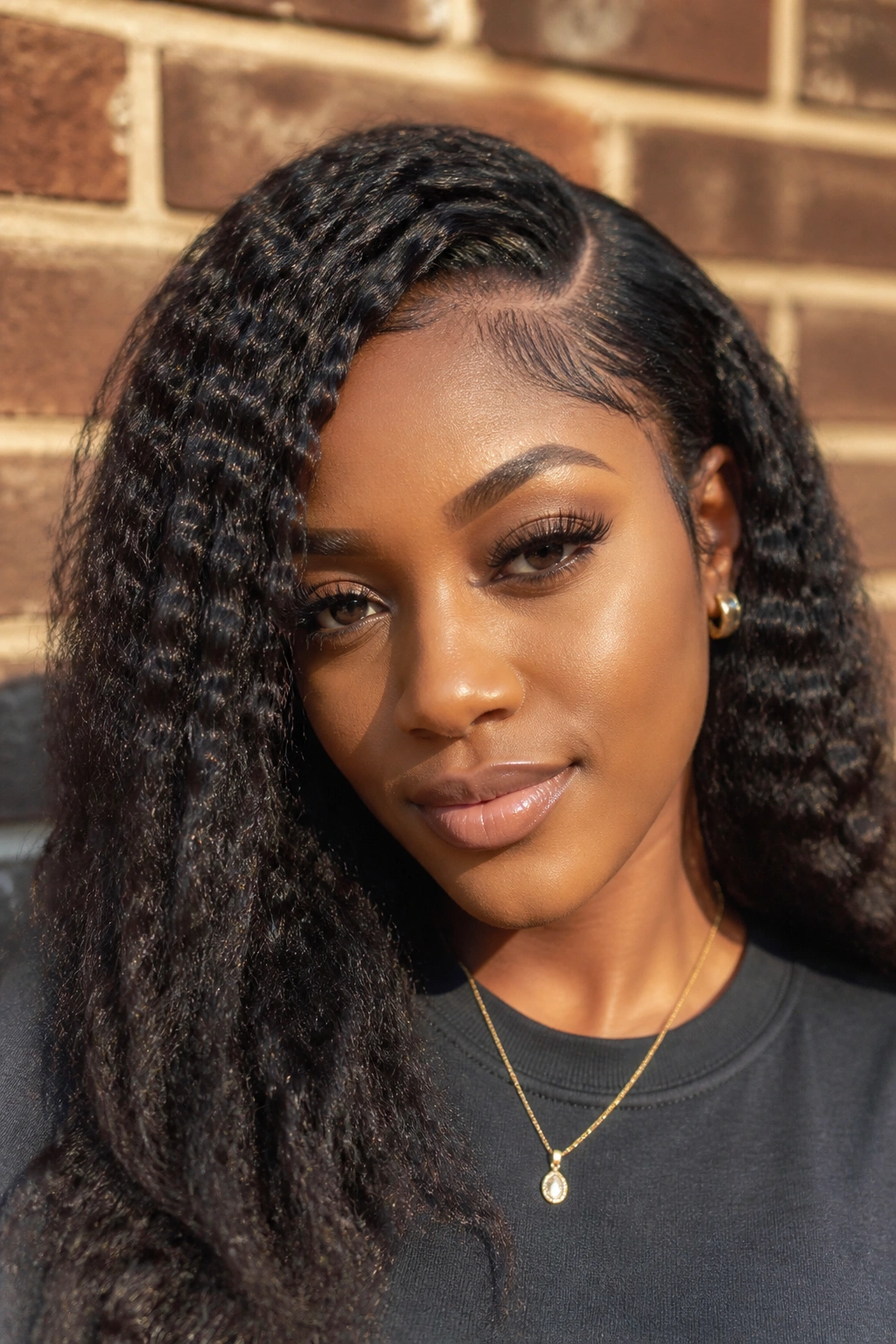 Close-up of a real Black woman with crimped weave and side part