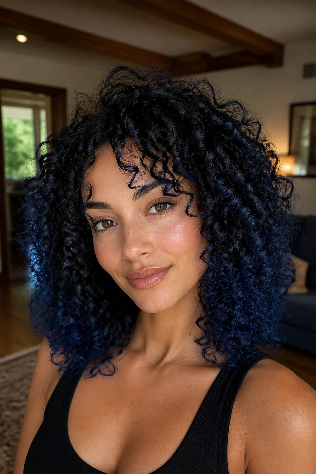 Close-up of a woman with curly navy halo around her curls