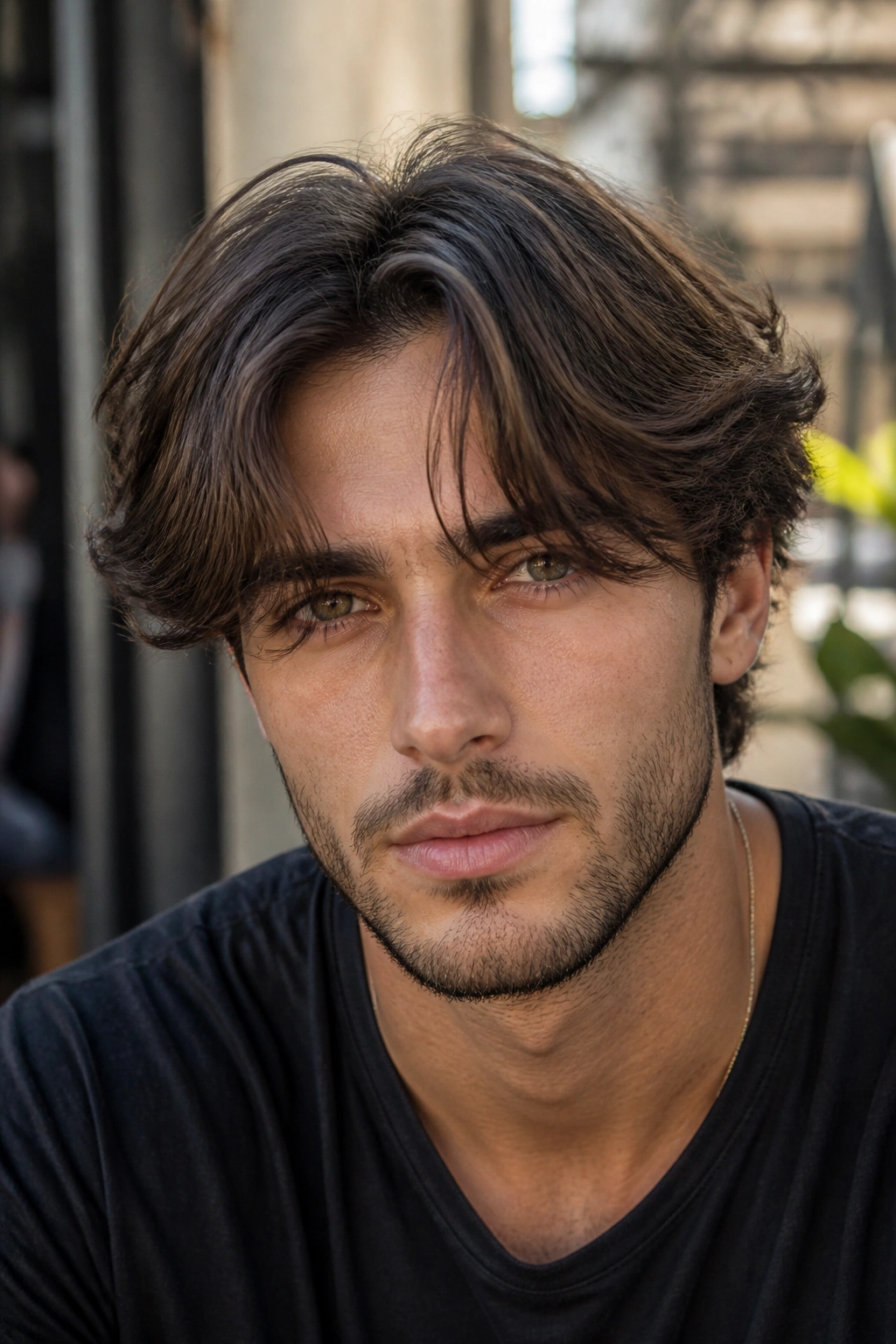 Close-up of a man with curtain fringe and soft front layers.