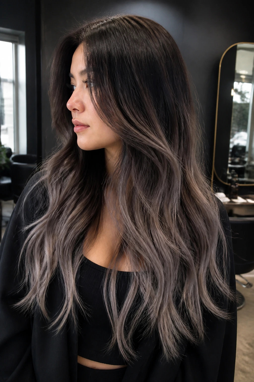 Real person with dark cacao roots and frosted ends for cool brunette look