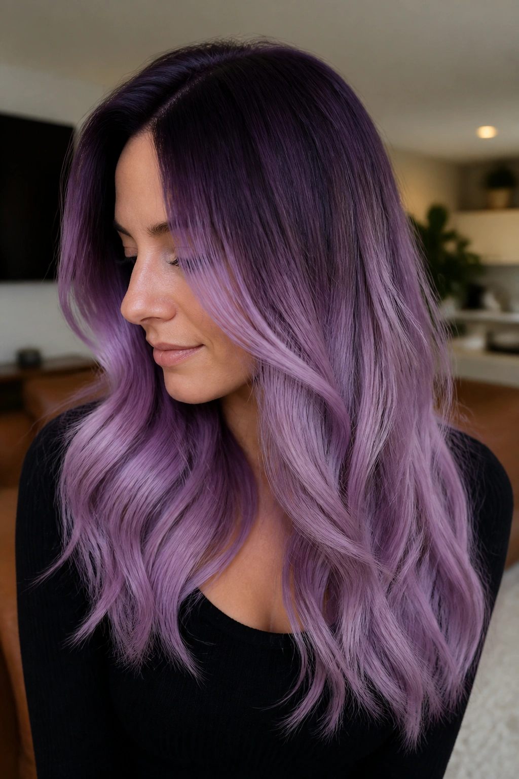 Close-up of dark plum roots transitioning to lilac mid-lengths on long hair
