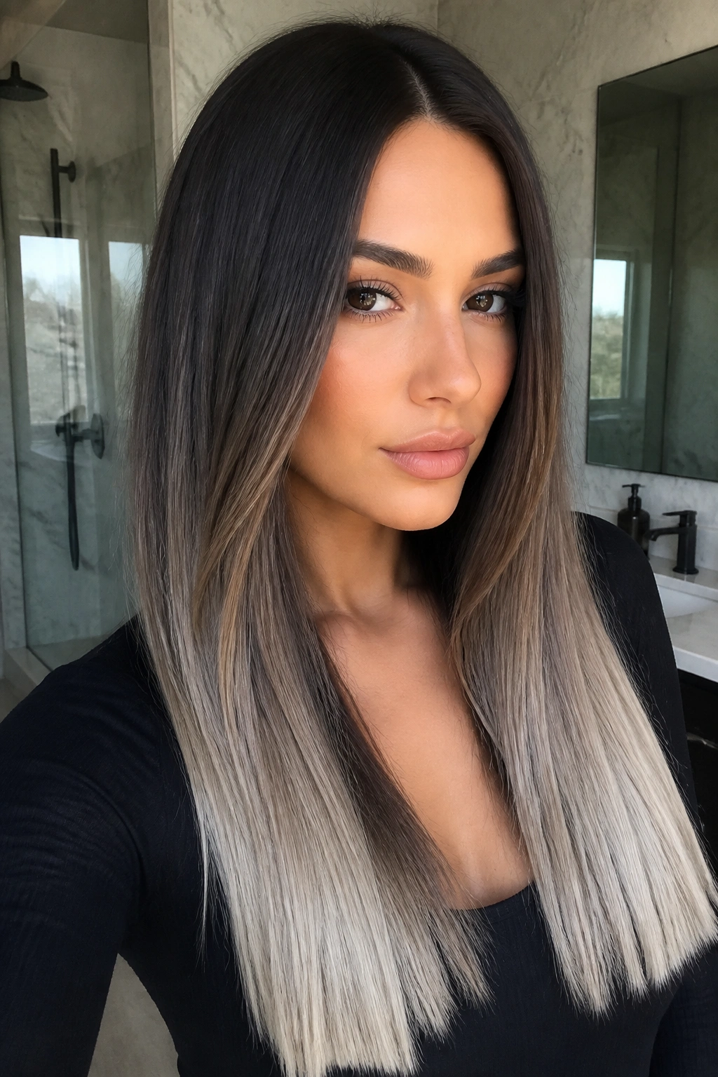 Close-up of a real woman with deep brunette hair and frosted ends.