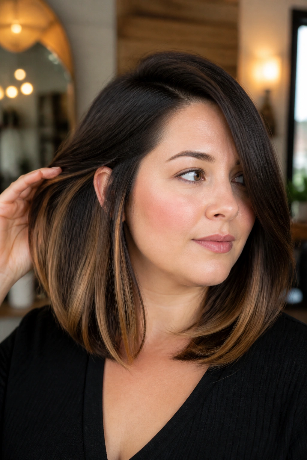 Close-up of a real woman with a deep side-part lob and caramel underlayers for a round face