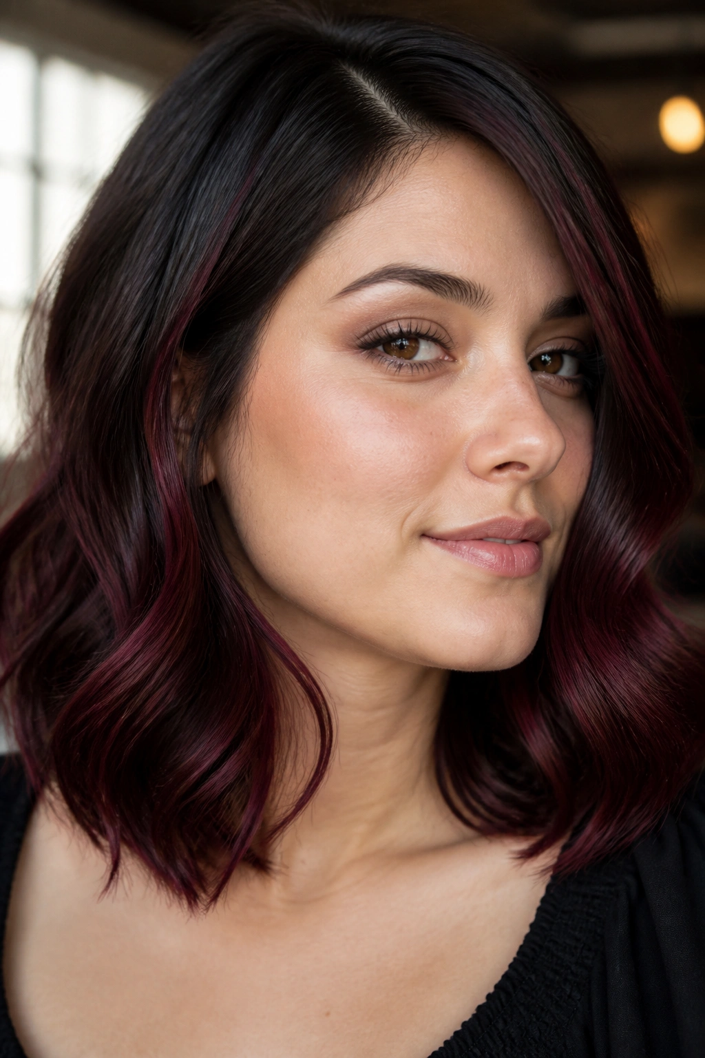 Close-up portrait with deep wine highlights along the jawline