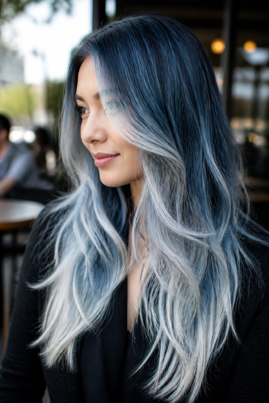 Real woman with denim blue to ice white layered ombre hair.