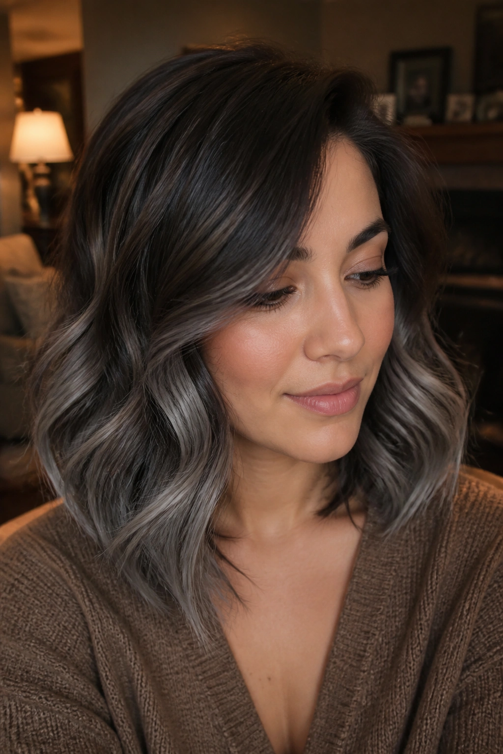Close-up of shoulder-length hair with a smoke melt fade from dark brown to gray.