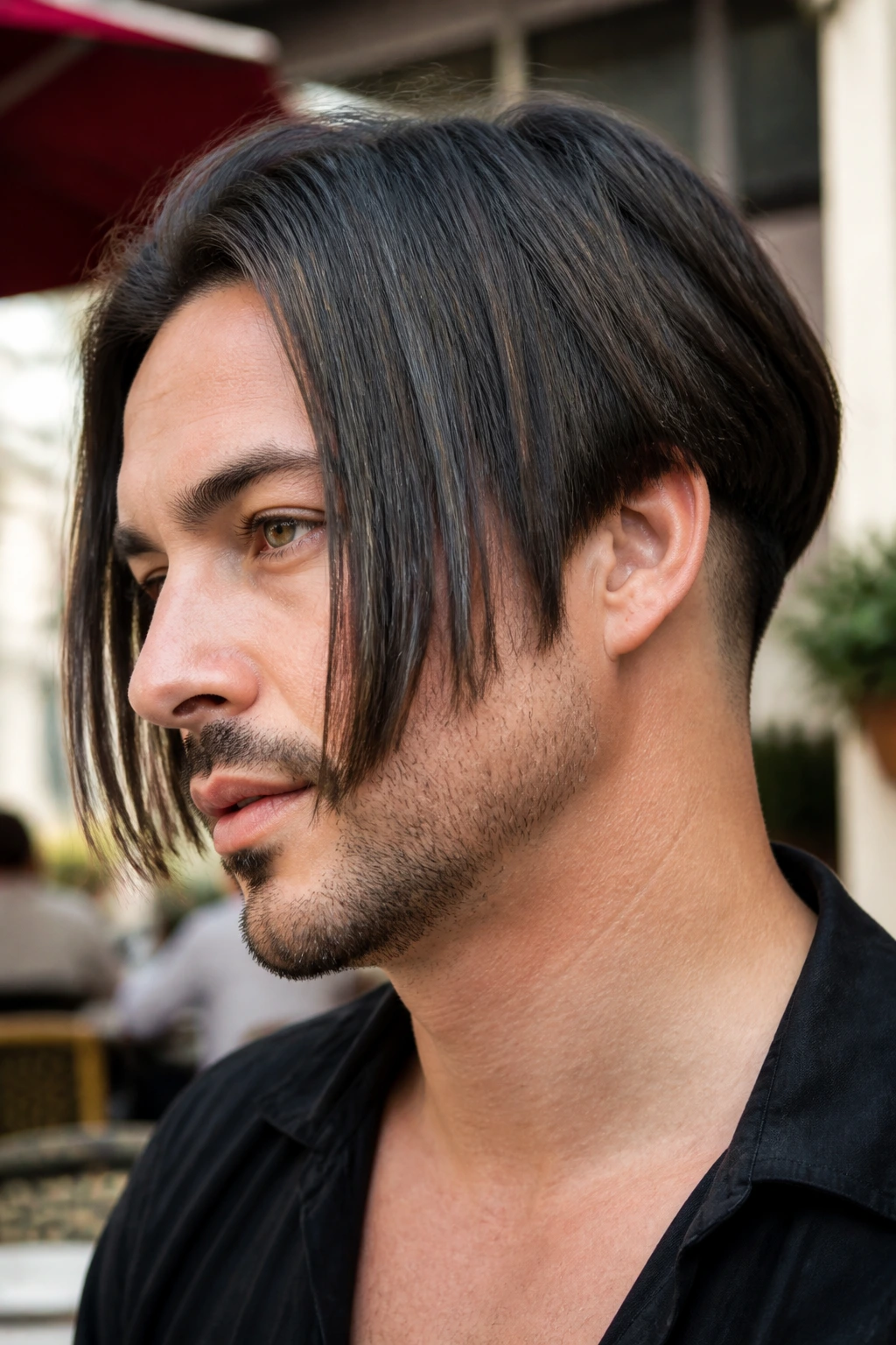Close-up of man with disconnected inverted bob showing a distinct break