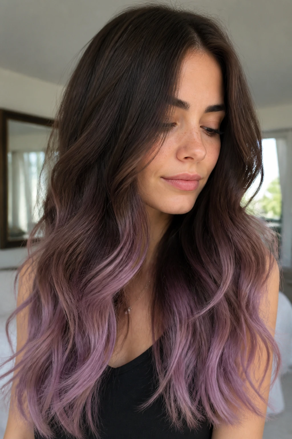 Chocolate brown hair with dusty lavender ends in a close-up portrait