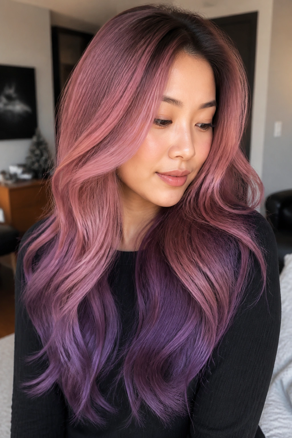 Real woman with dusty pink to violet ribbon layers in long hair
