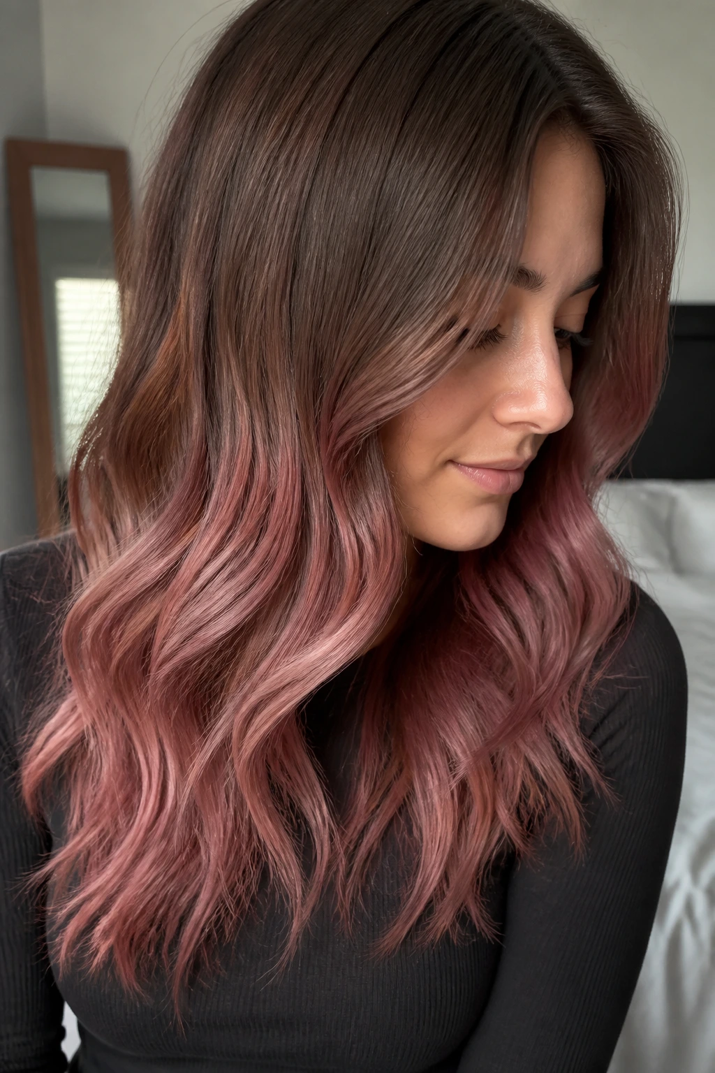 Real woman with dusty rose fade on mushroom brown hair