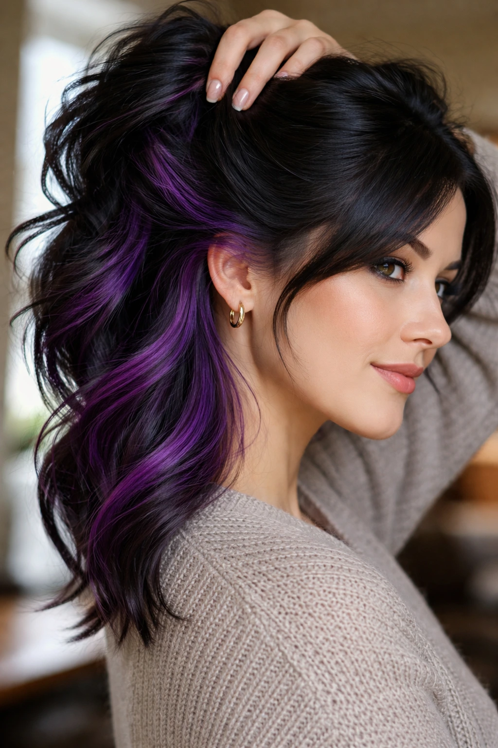 Close-up of hair showing electric grape peekaboo underlayers.