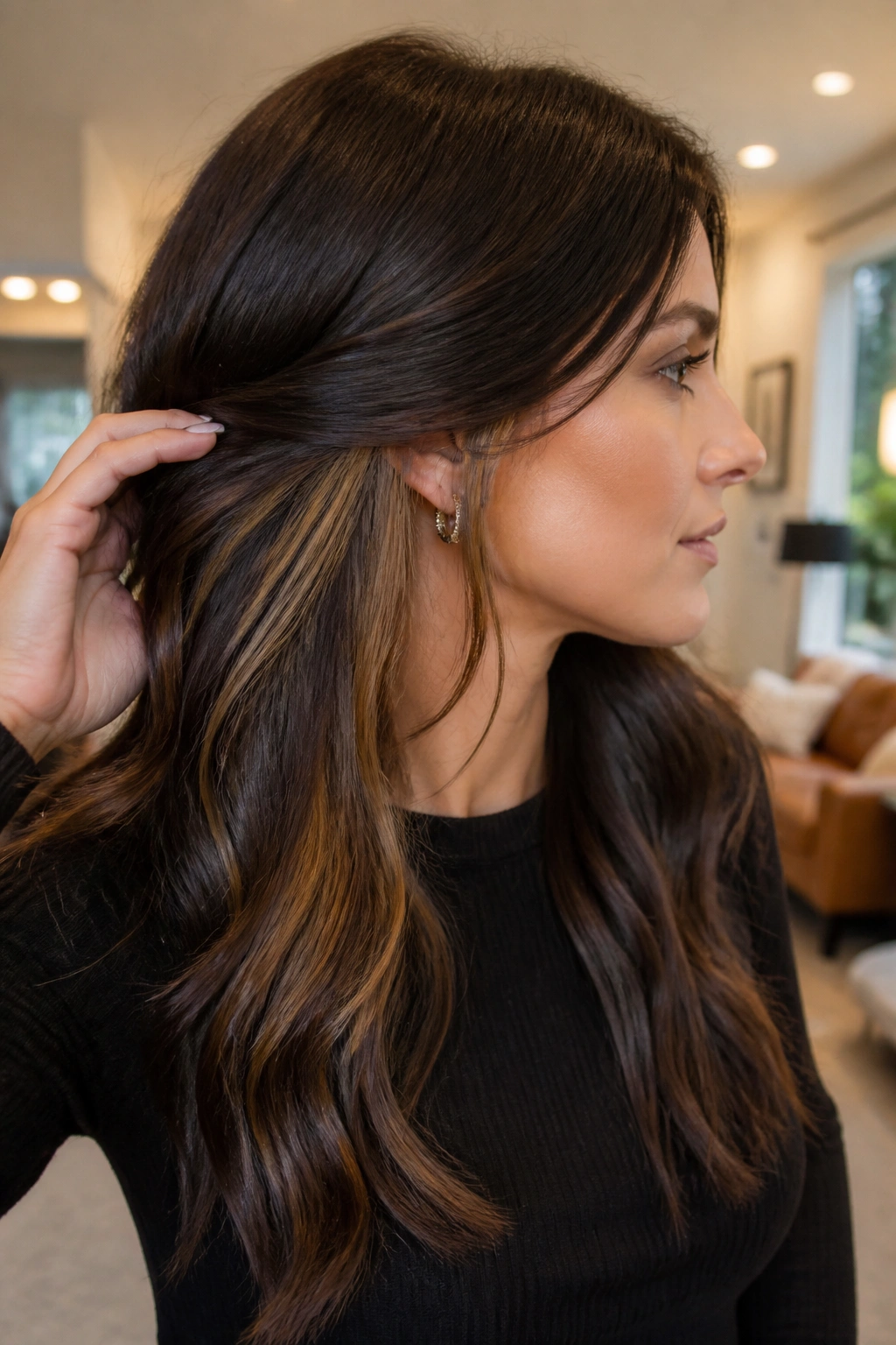 Three-quarter profile of a real woman showing espresso top with caramel peekaboo panels near the ear
