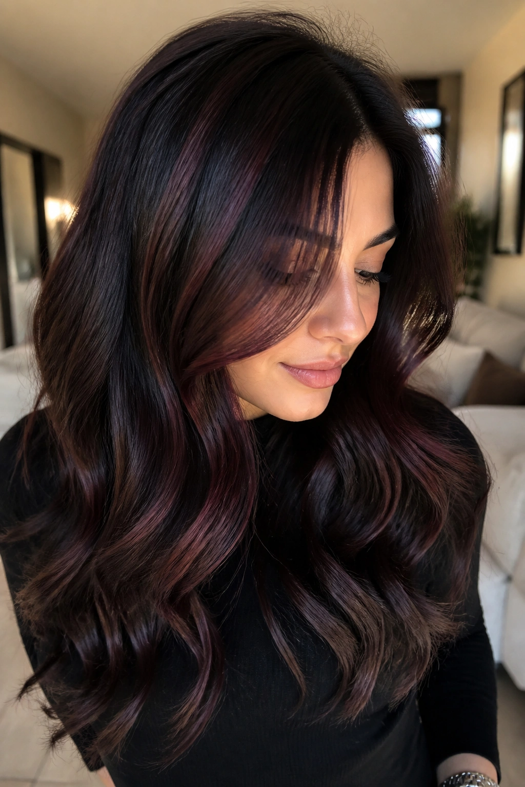 Close-up of a real woman with espresso brown hair and glossy mahogany highlights