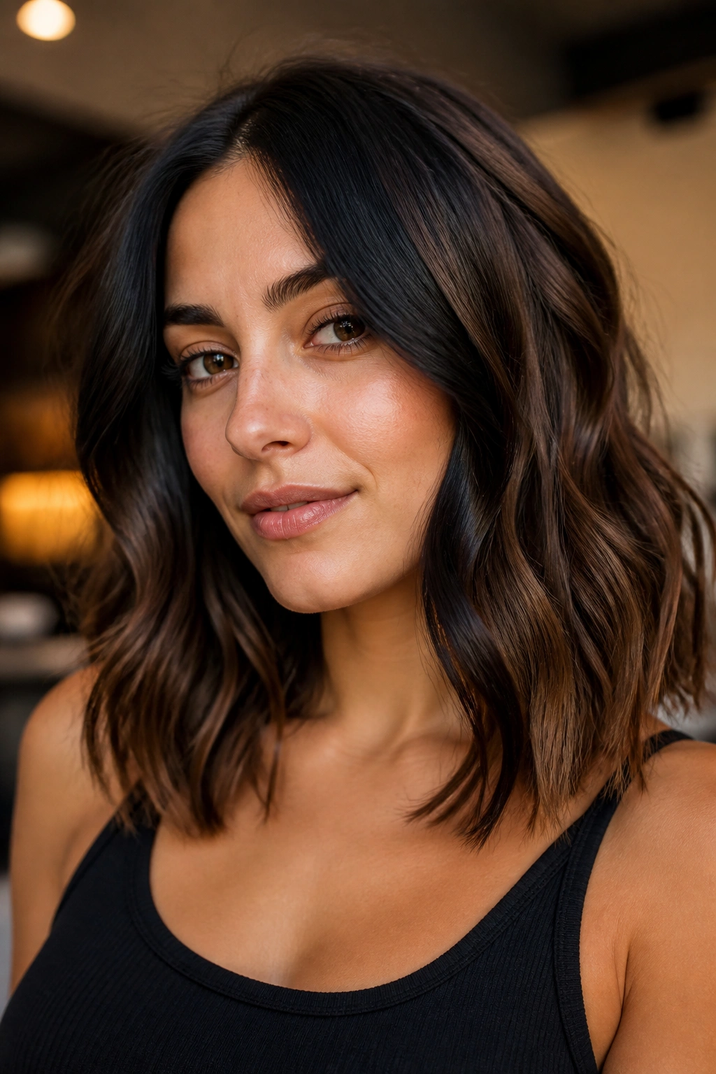 Close-up of a face-framing money piece balayage around the temples