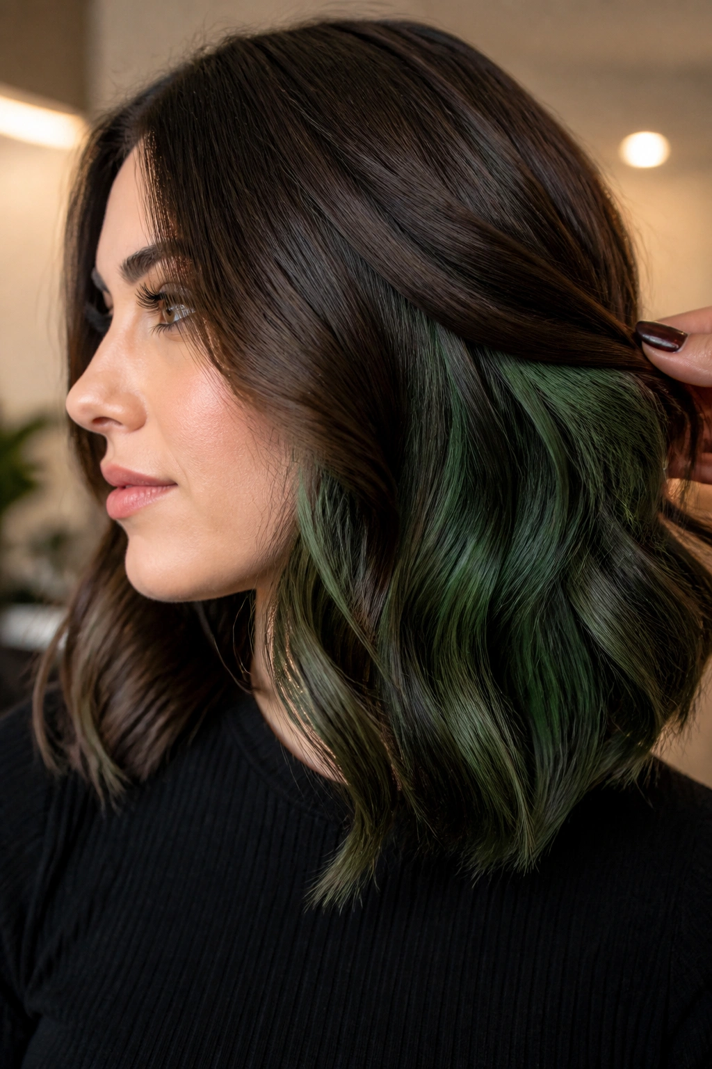 Portrait showing forest green peekaboo underlights under brown hair