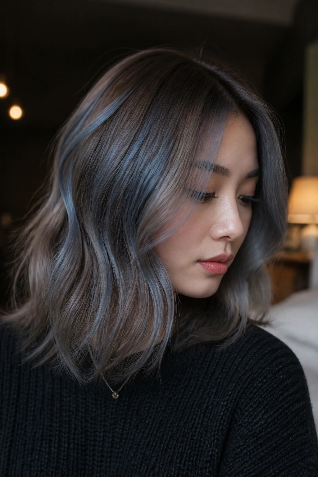 Close-up portrait of a real person with frost blue mushroom brown hair