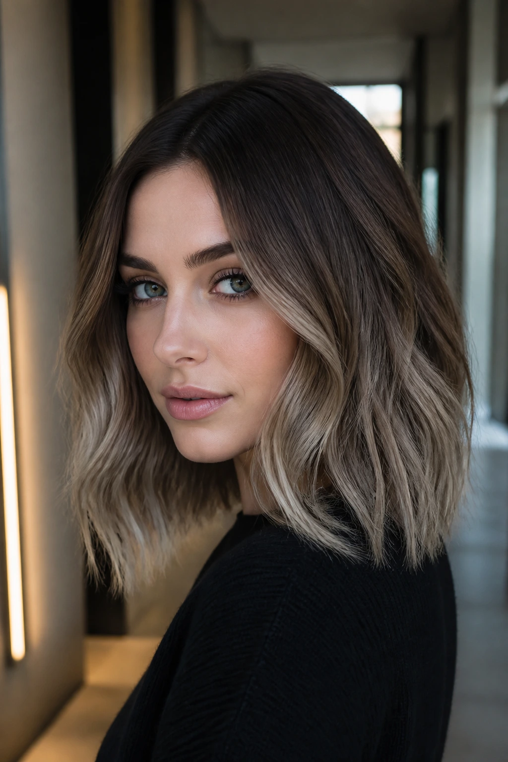 Close-up portrait of a real woman with frosted brown ombré hair