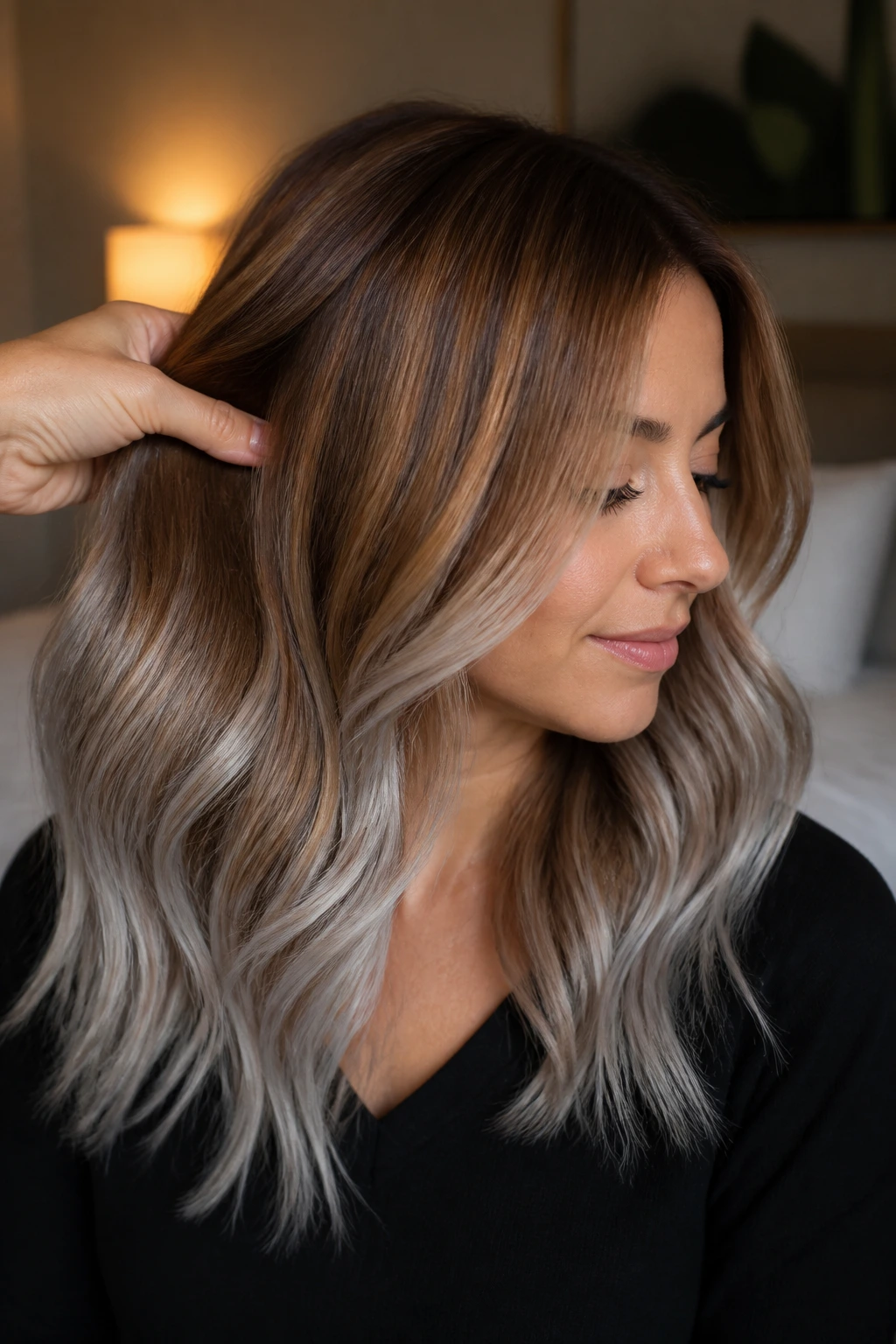 Close-up of caramel brown hair transitioning to frosted silver ends