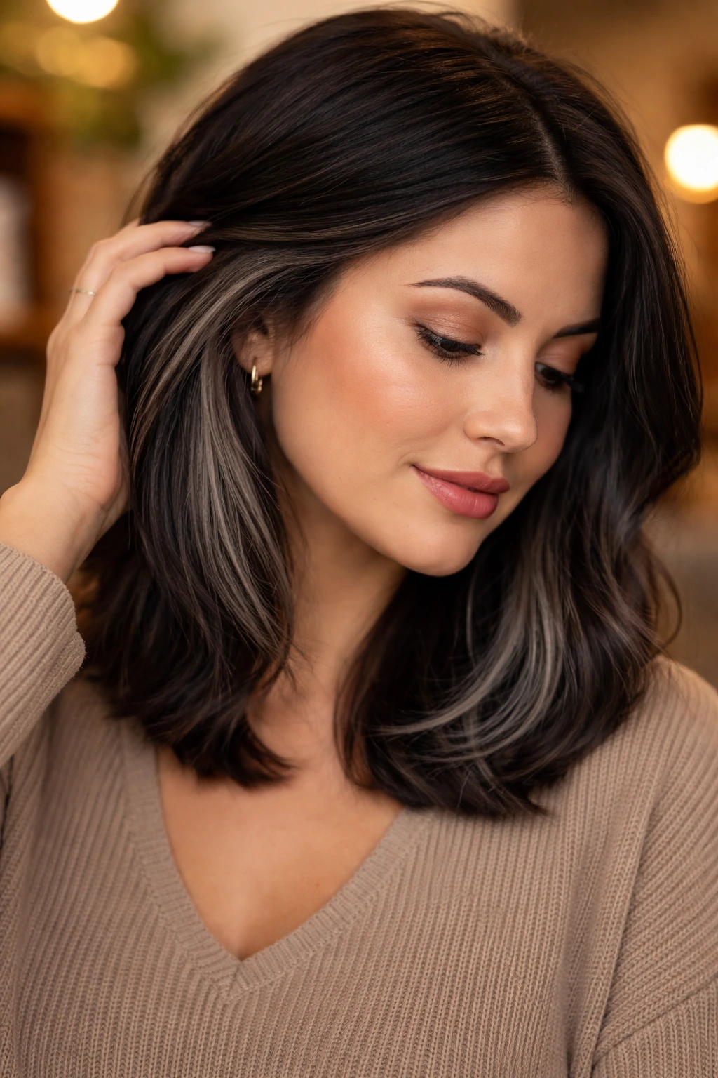 Shoulder-length hair with graphite peekaboo panels under the top layer