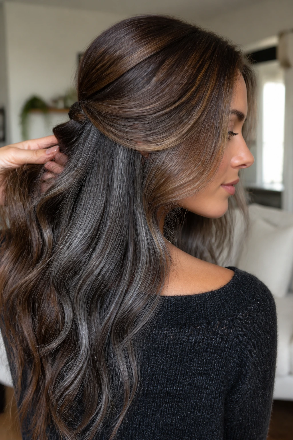 Long hair with graphite underlayer peeking through via movement.