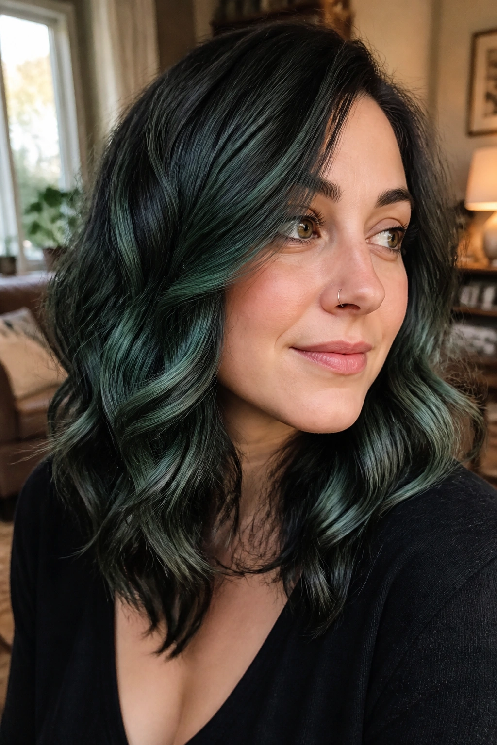 Close-up of a real woman with Juniper Layering hair showing layered greens in a forest-inspired palette