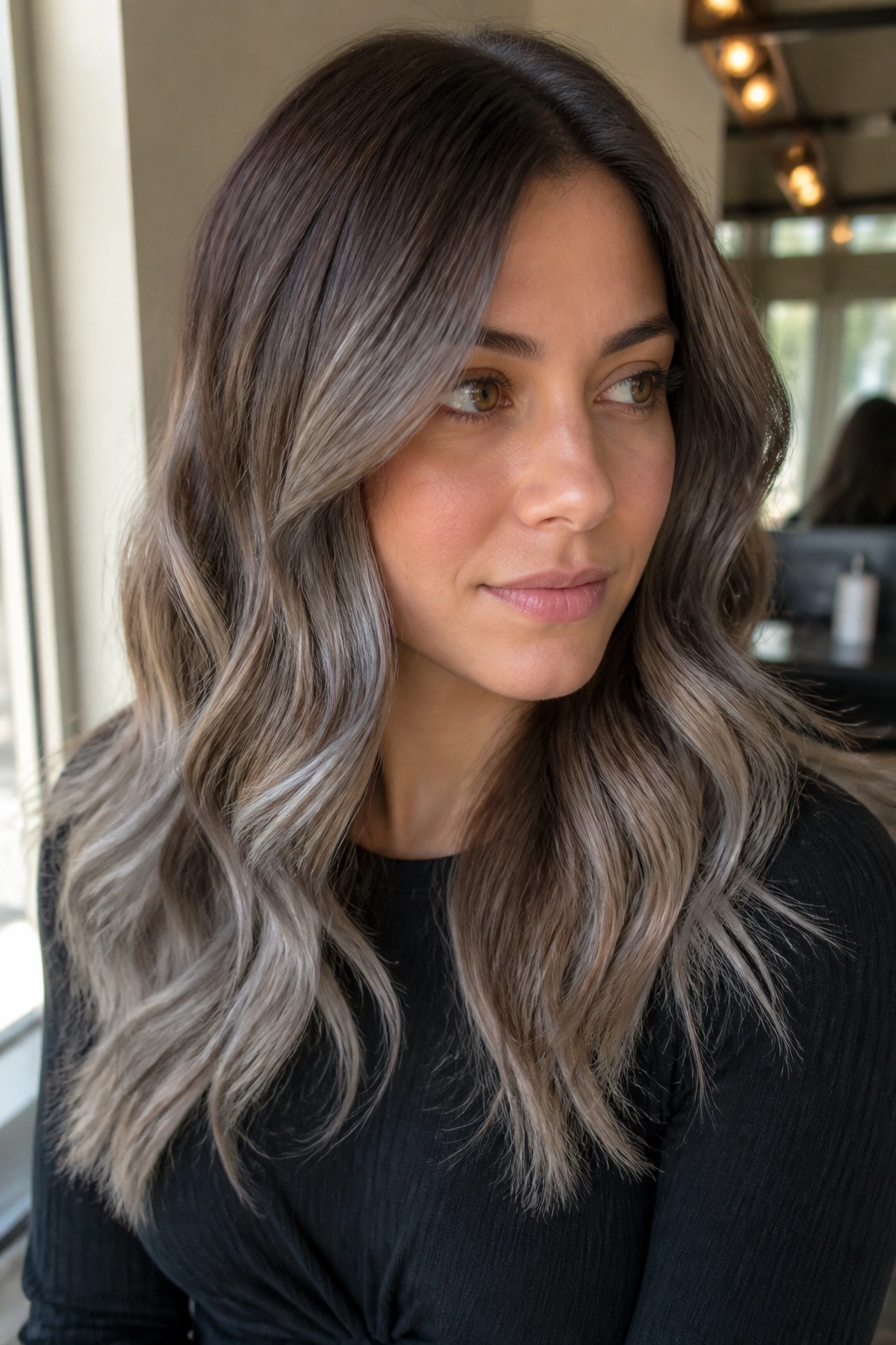 Warm brown hair with frosted grey balayage close-up