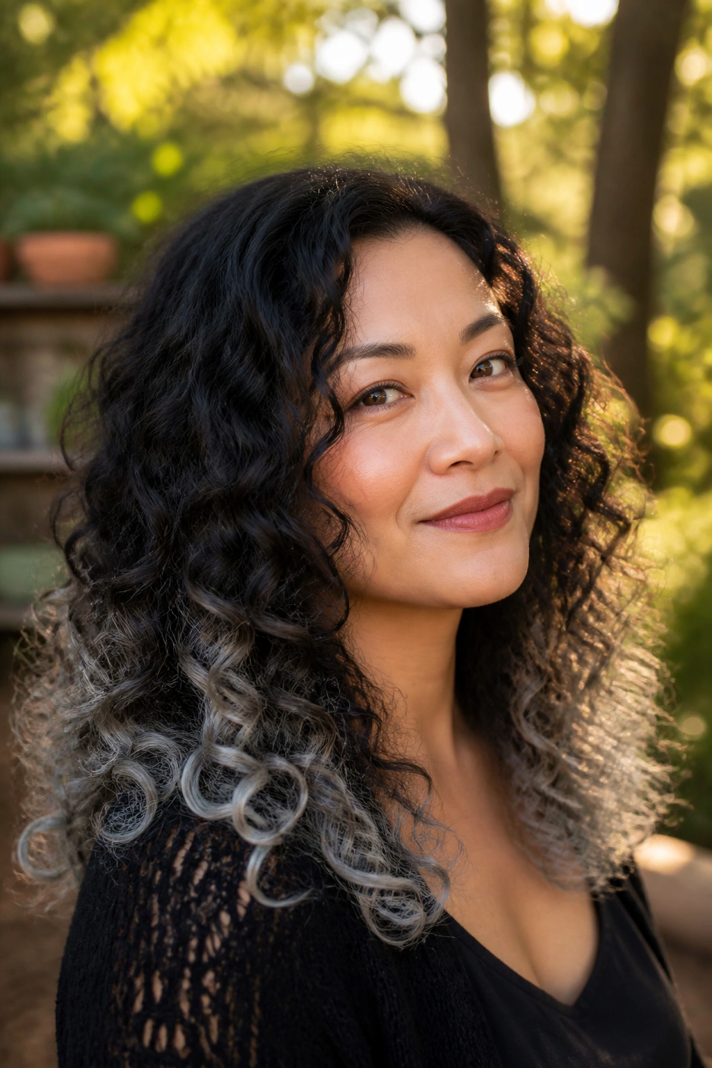 Close-up of grey-dipped curls on a real woman