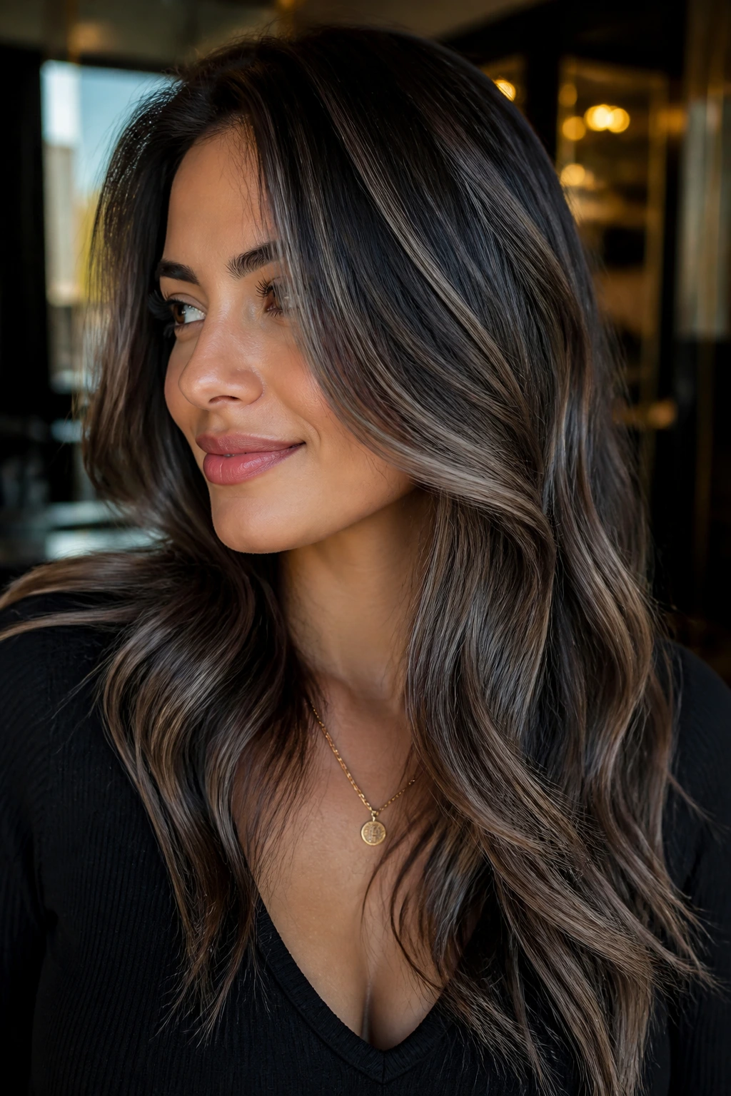 Close-up of a real person with gunmetal highlights in dark brown hair