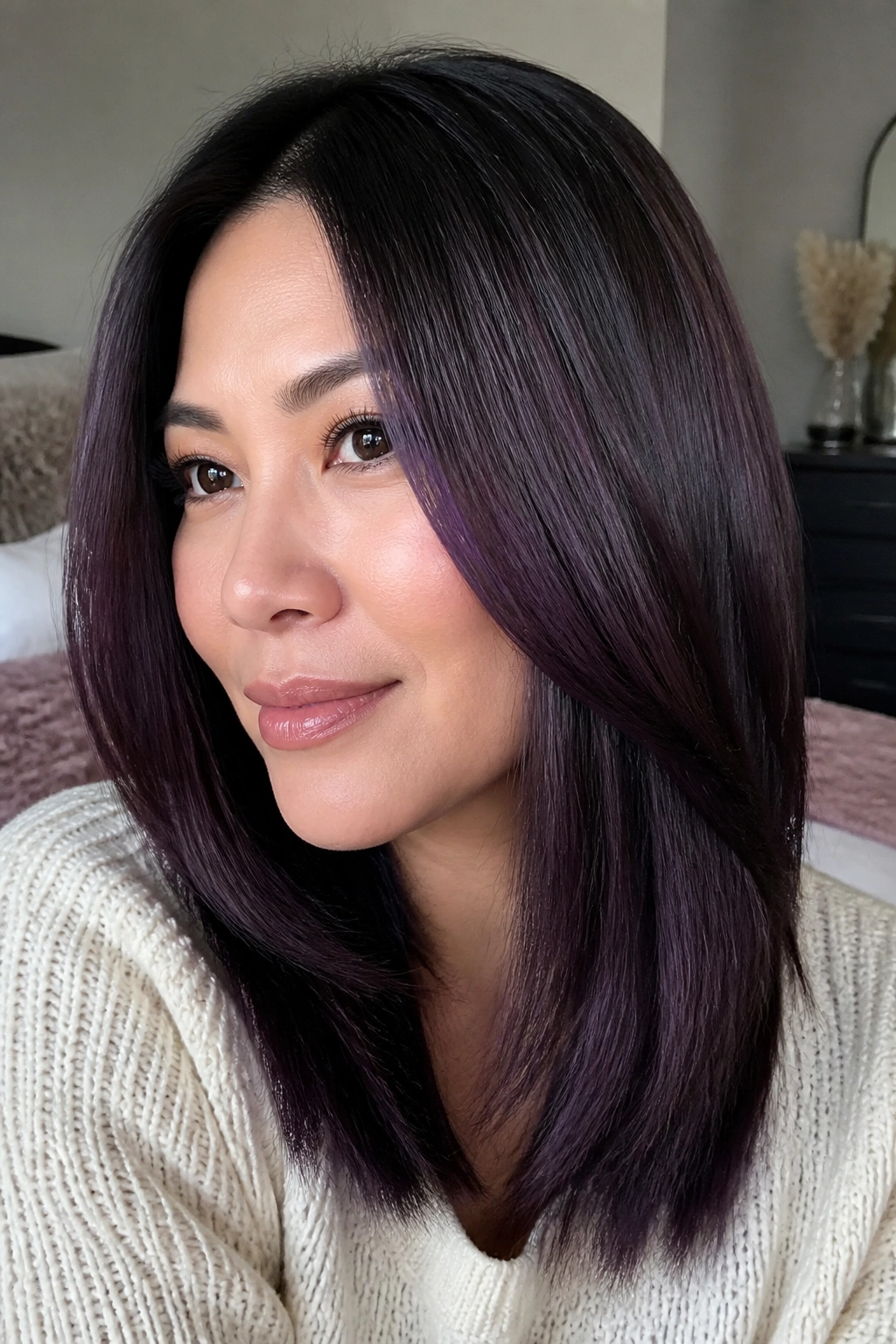 Straight mid-length hair with blackberry veil highlights