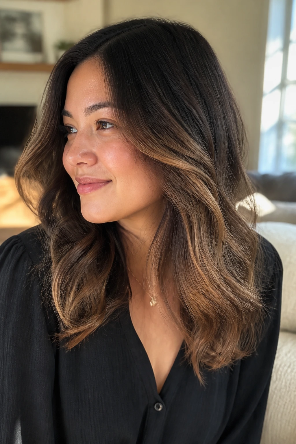 Close-up of a real woman with halo highlights around outer hair layers in a sunlit living room