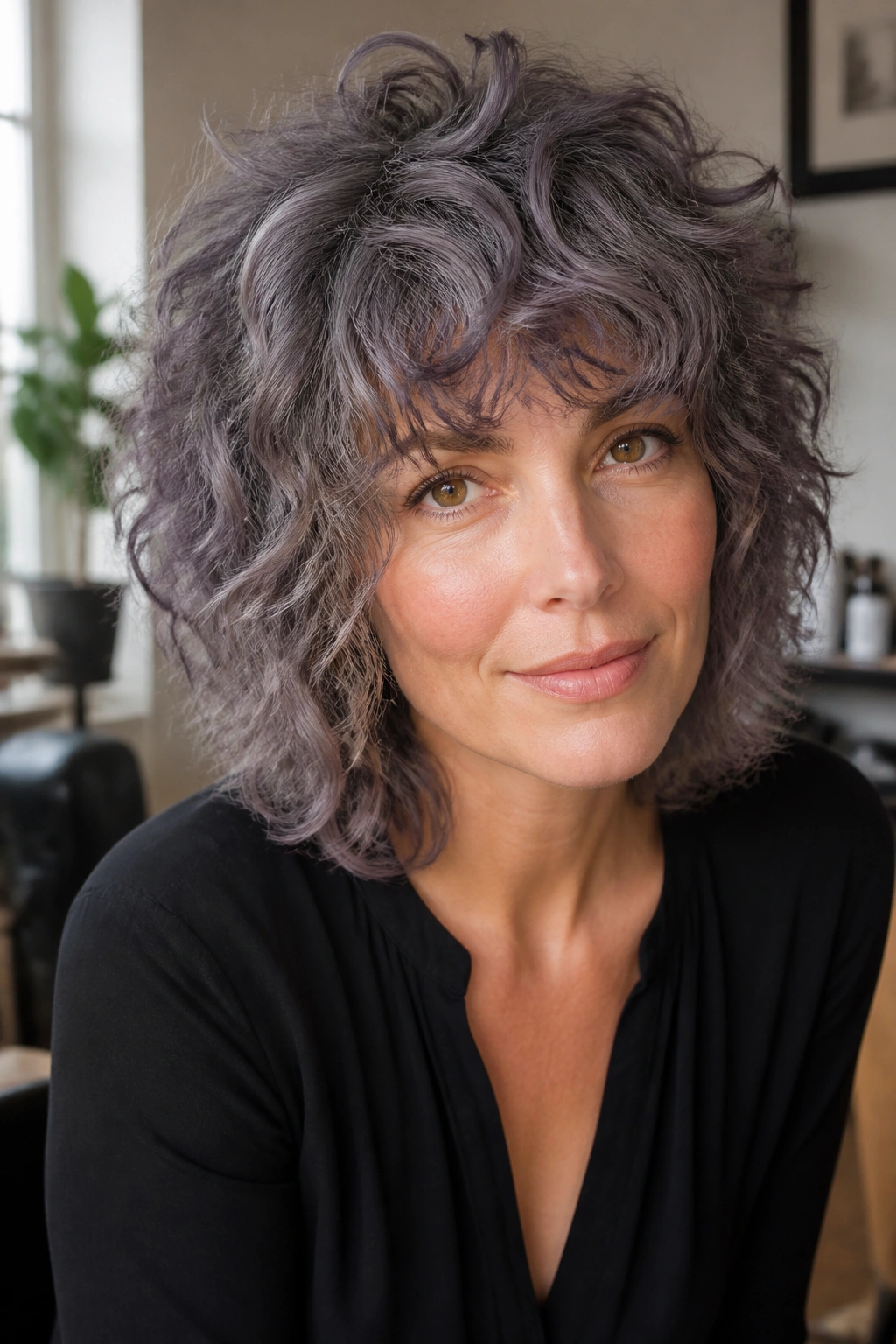 Close-up of Heather Gray Curly Shag hairstyle on a real person with defined curls