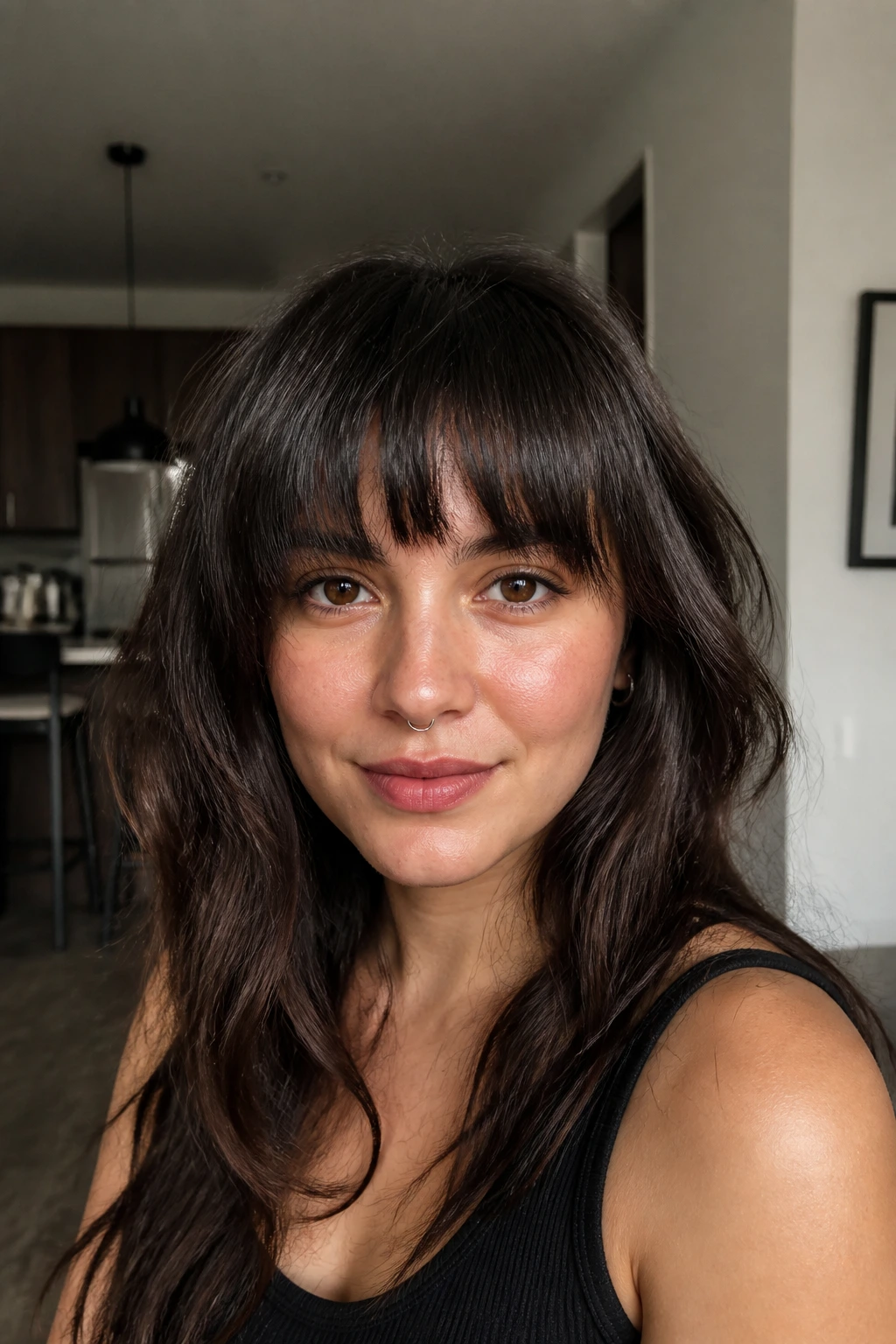 Close-up of a real woman with heavy, jagged bangs and textured ends.