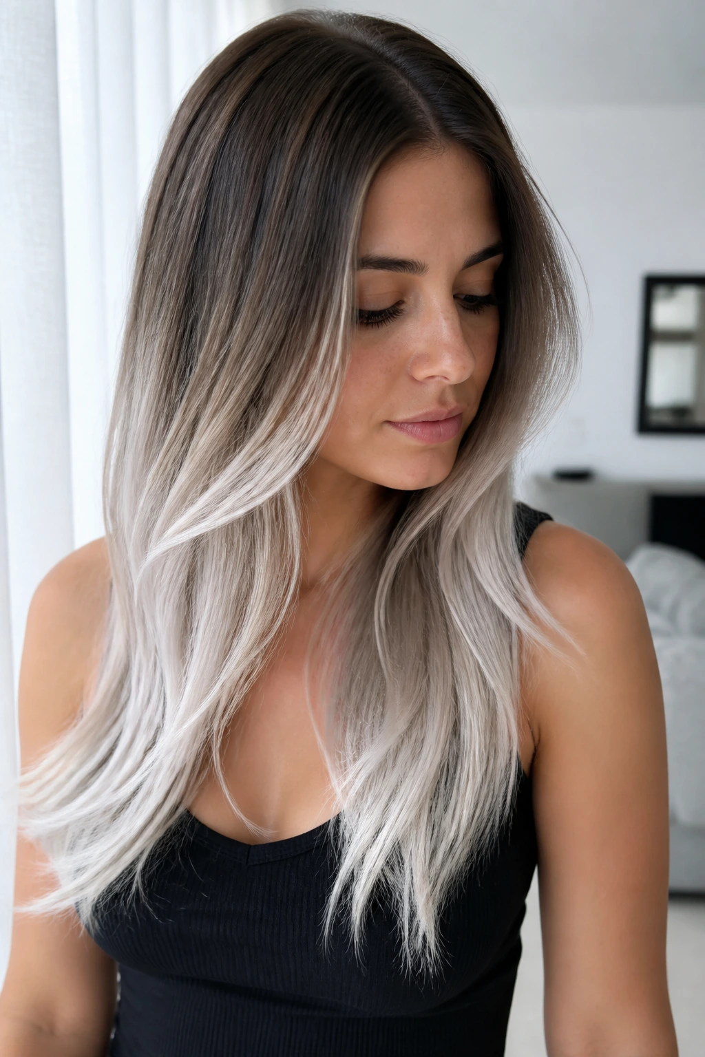 Close-up portrait of Icy Platinum Ends with dark roots and icy platinum ends
