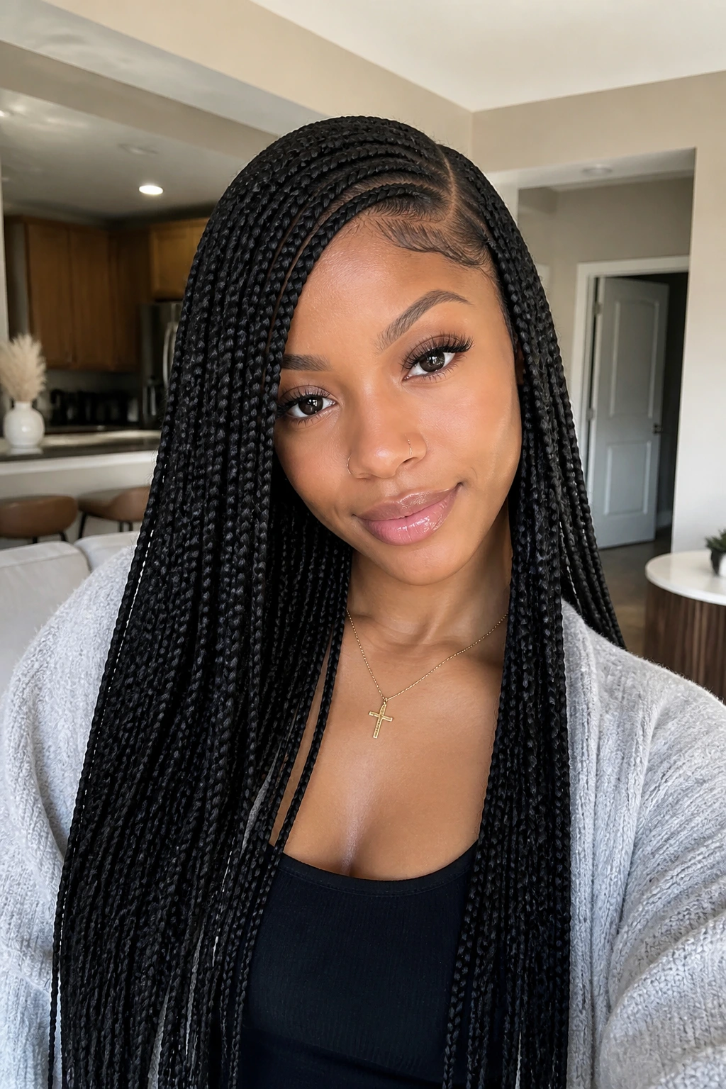 Close-up portrait of real person with knotless braids and side part