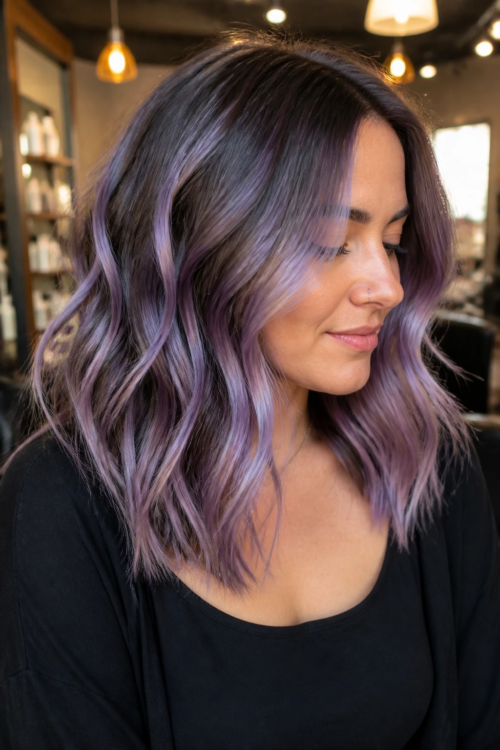 Portrait of a person with full-head lavender foilayage on brown hair