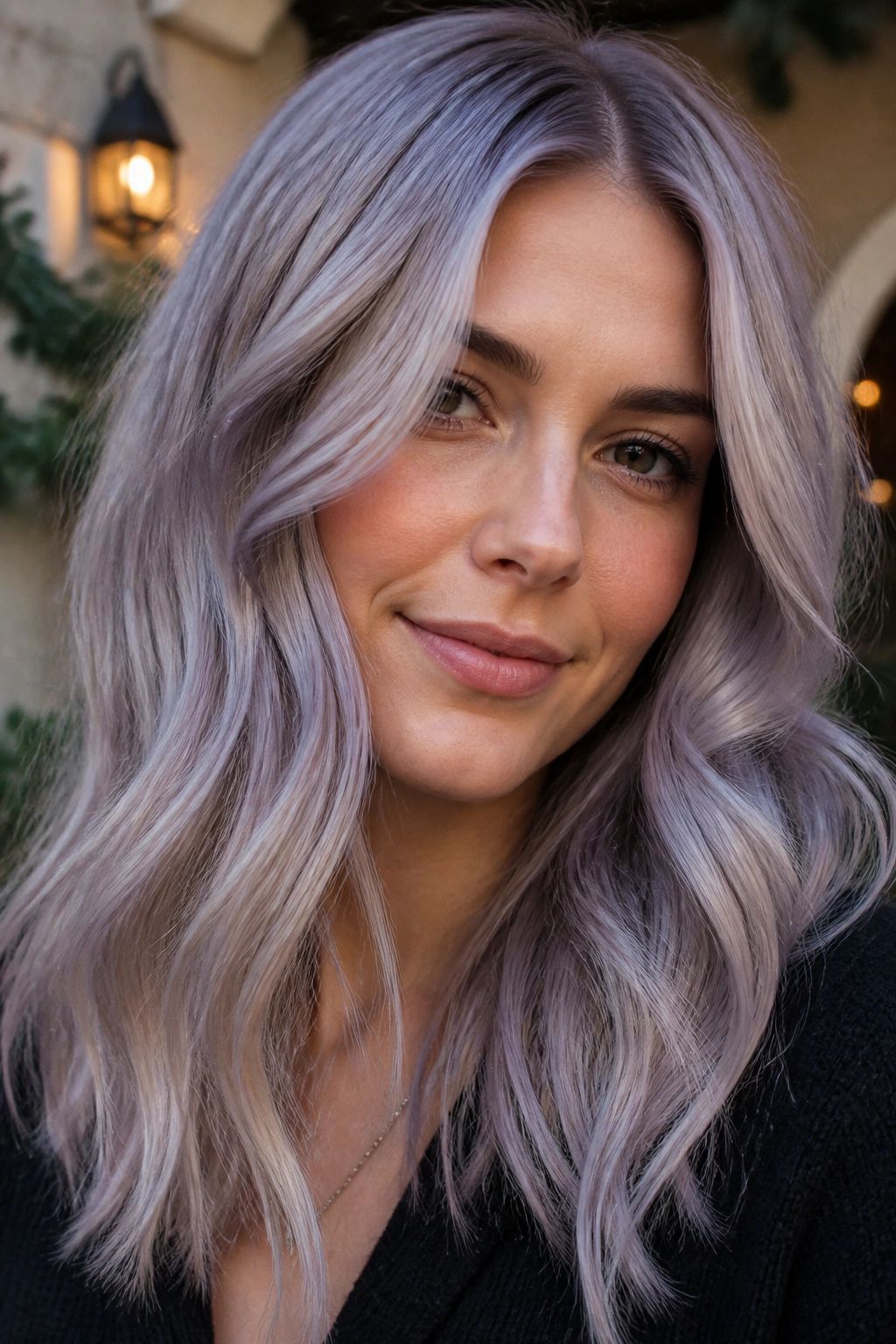 Close-up portrait of a real woman with lavender grey blonde hair in soft evening light