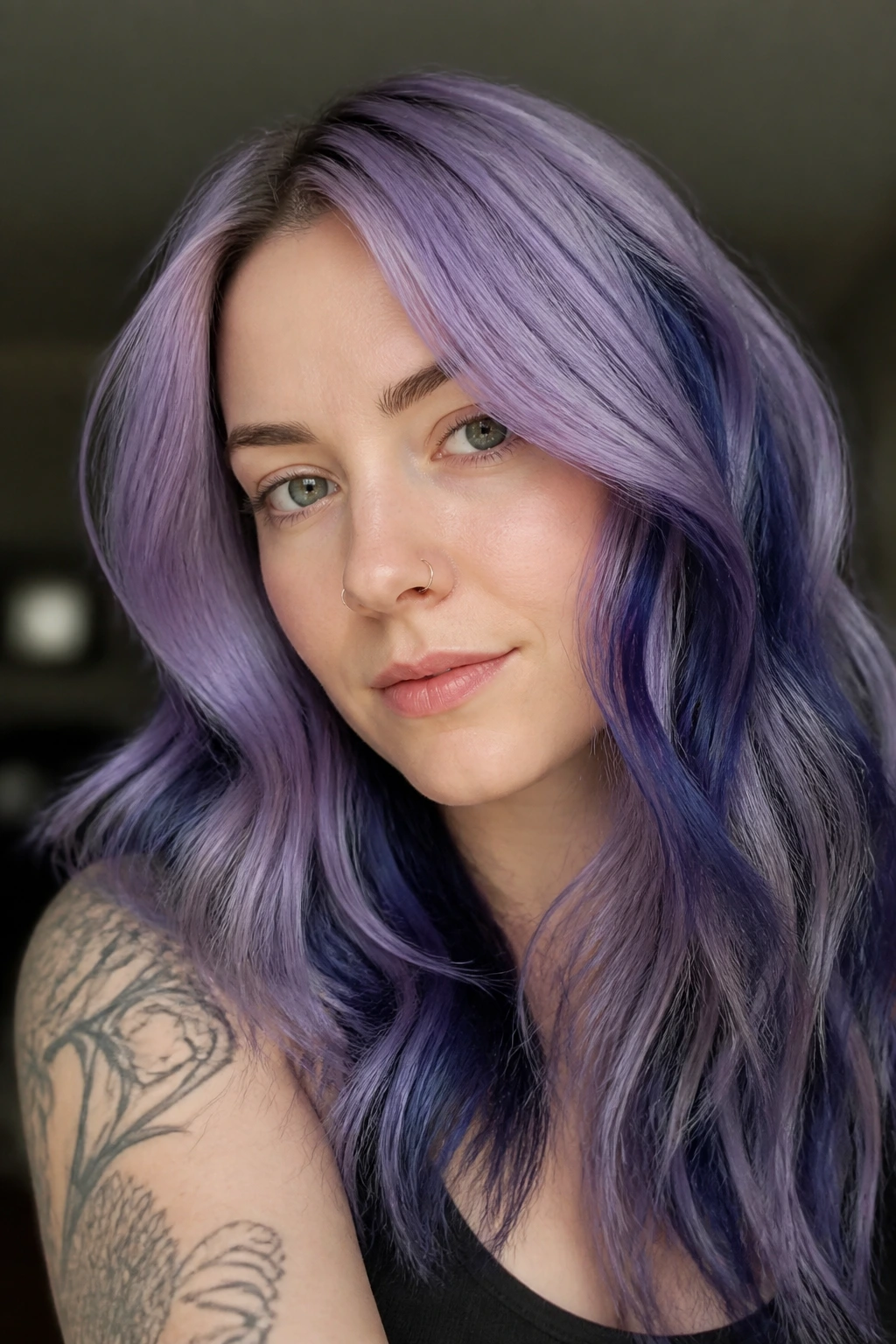 Portrait of a person with smoky lavender hair and navy lowlights