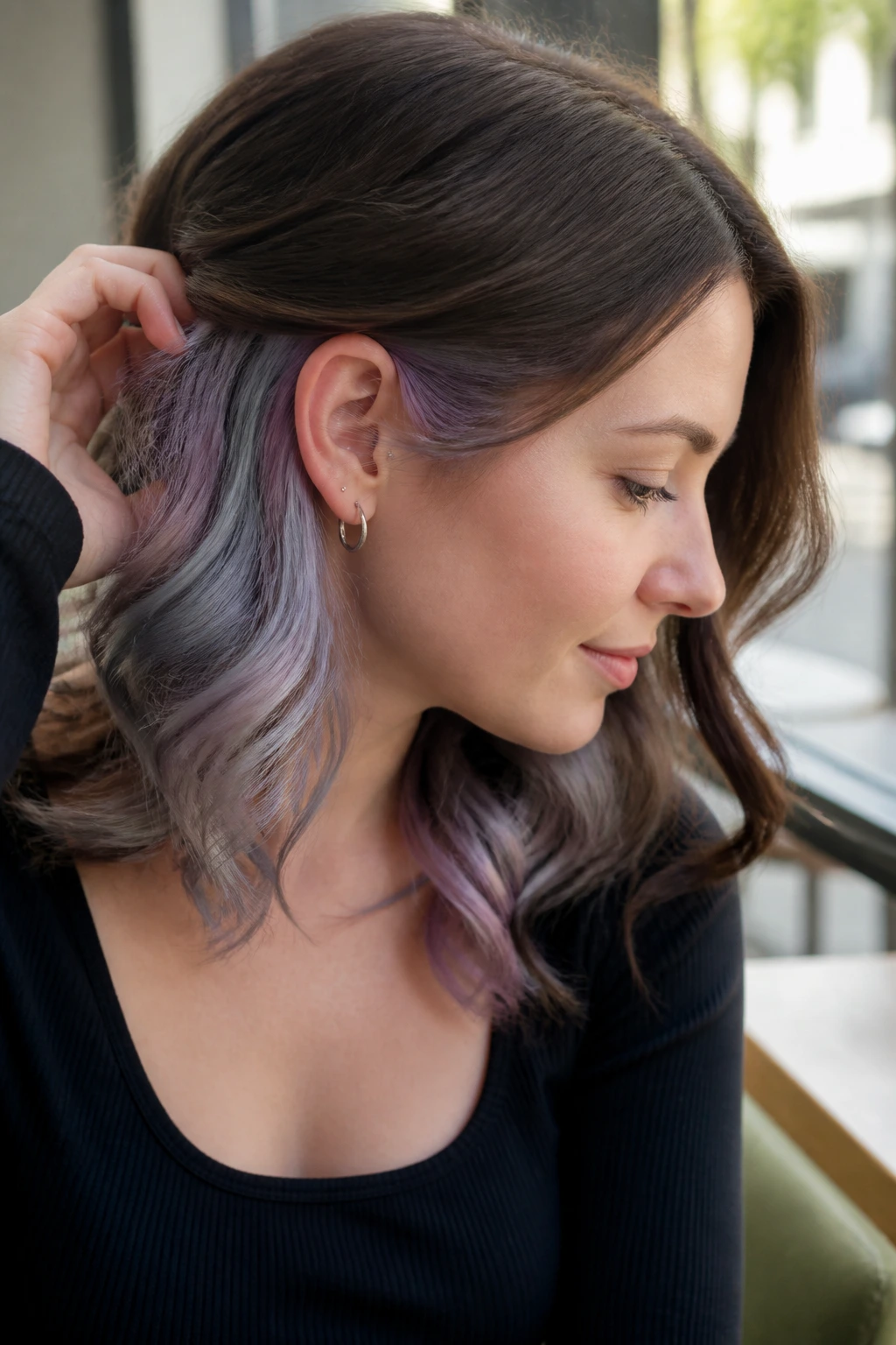 Hair with lavender and silver peekaboo underlayer visible at the nape