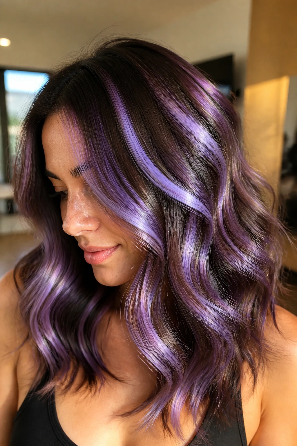 Close-up of a real person with wavy brown hair ribbons of iridescent lavender slices weaving through the waves