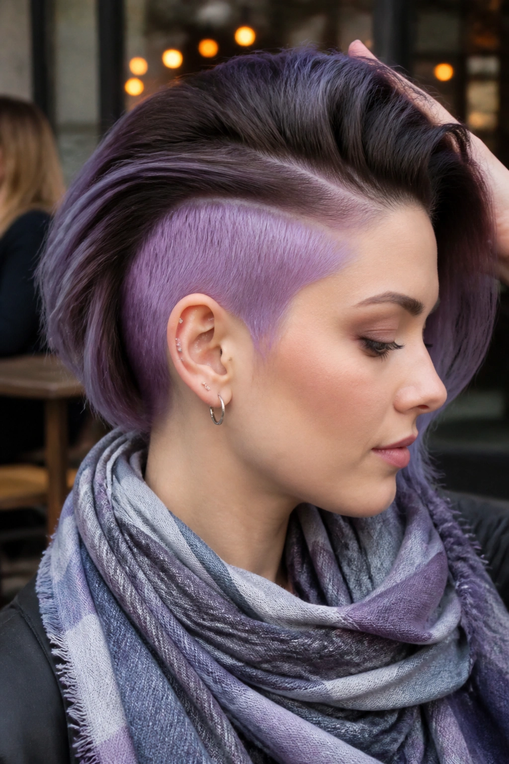 Portrait of a real person with smoky lavender undercut visible under swept top layer